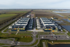 Aerial drone views of a supercomputer data center, artificial intelligence, and internet infrastructure in the Netherlands. Big data, quantum computing, supercomputer.