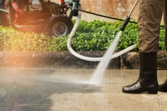 High pressure deep cleaning.
Worker cleaning driveway with gasoline high pressure washer ,professional cleaning services.