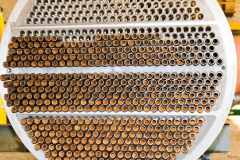 Production of a large tube bundle for a shell-and-tube heat exchanger in an industrial production room of a shop with equipment at an oil refinery, petrochemical, chemical plant, enterprise