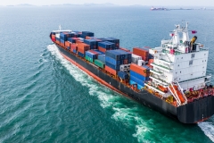 Aerial view cargo container ship sailing, container cargo ship in import export and business logistic and transportation of international by container ship in the open sea.