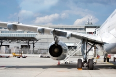 A passenger jet under maintenance at the airport. Checking mechanical systems for flight operations.