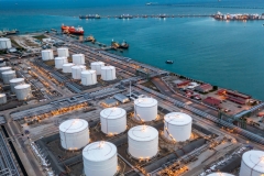 Aerial view oil terminal industrial facility storage tank oil and petrochemical product for transport to further storage facility, Storage tank petroleum petrochemical refinery product at oil terminal