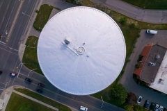 Water tower or watertower tank reservoir used to pressurize distribution for potable water emergency storage for fire protection. Golden hour sunset.