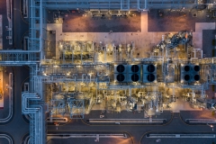 Aerial view power plant for oil refinery petrochemical industrial, Oil  refinery factory power plant at night and pipeline steel, Oil refinery factory and power plant.