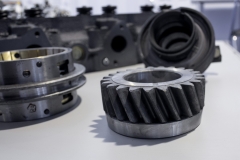 gear and other metal parts on a light table surface