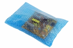 Spare parts and electronic components packed in soft red  film with air bubbles isolated