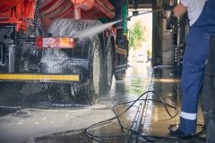 Close up of woman washing big truck