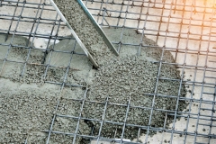 Concrete pouring during commercial concreting floors of buildings in construction site