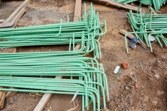 Piles of Right Angle Rebar on the Ground at Construction Site