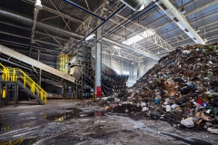 GRODNO, BELARUS - OCTOBER 2018: Solving problem of environmental pollution with waste as garbage processing plant - huge pile of garbage prepared for loading onto conveyor belt for further sorting and processing