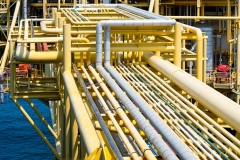 Oil and gas processing plant with pipe line valves.Steel pipelines and valves.Oil pipeline valves in the oil and gas industry.