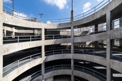 A spiral ramp in a concrete parking garage.